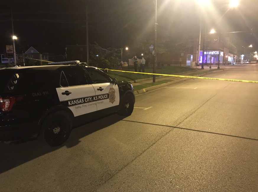 In this image from 41 KSHB Kansas City Action News police work the scene of a shooting outside a Kansas City, Kansas bar Sunday, Oct. 6, 2019. (41 KSHB Kansas City Action News via AP)