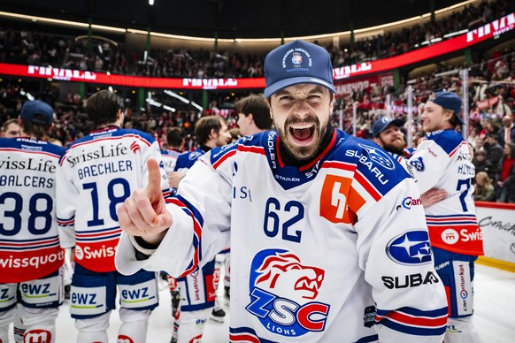 ZSC Lions&#039; players with Denis Malgin celebrate the title of Swiss Champion after winning by 2:3 during the fifth leg of the National League Swiss Championship final playoff game between Lausanne  ...
