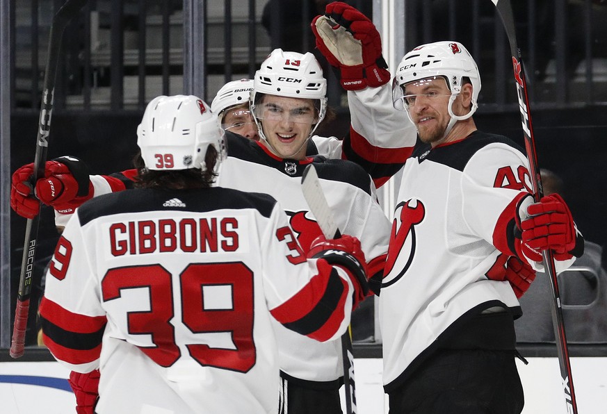 New Jersey Devils celebrate after right wing Michael Grabner, right, scored against the Vegas Golden Knights during the third period of an NHL hockey game Wednesday, March 14, 2018, in Las Vegas. (AP  ...