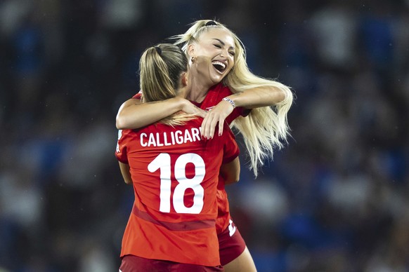 Switzerland&#039;s Viola Calligaris celebrates with Alisha Lehmann, right, at the end of the Euro 2025, group A, soccer match between Switzerland and Iceland at Stadion Wankdorf in Bern, Switzerland,  ...