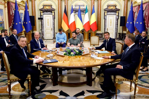 Italian Prime Minister Mario Draghi, left, German Chancellor Olaf Scholz, second left, Ukrainian President Volodymyr Zelenskyy, center, French President Emmanuel Macron second right, and Romanian Pres ...