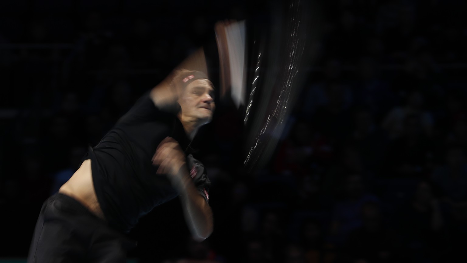 Switzerland&#039;s Roger Federer serves to Italy&#039;s Matteo Berrettini during their ATP World Tour Finals singles tennis match at the O2 Arena in London, Tuesday, Nov. 12, 2019. (AP Photo/Alastair  ...