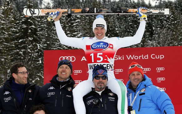 Italy&#039;s Christof Innerhofer celebrates with his team members after winning an Alpine Ski World Cup men&#039;s downhill, in Wengen, Switzerland, Saturday, Jan. 19, 2013. (AP Photo/Shinichiro Tanak ...