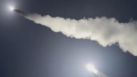 This image was made from a video posted by a Telegram channel affiliated with the Ukrainian military on Tuesday, Nov. 19, 2024. The channel says it shows U.S.-supplied ATACMS missiles being fired from ...