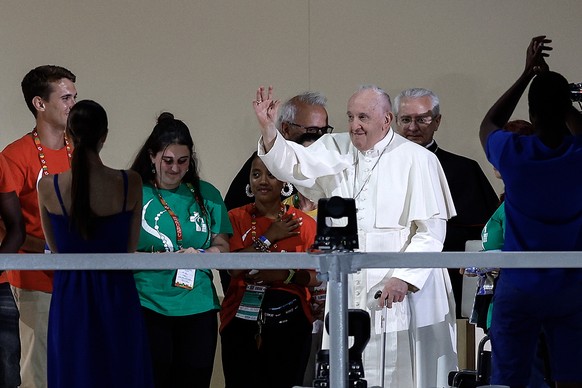 epa10786816 Pope Francis (C-R) waves during an Evening Vigil on World Youth Day (WYD) at Parque Tejo in Lisbon, Portugal, 05 August 2023. The Pontiff is in Portugal on the occasion of World Youth Day  ...