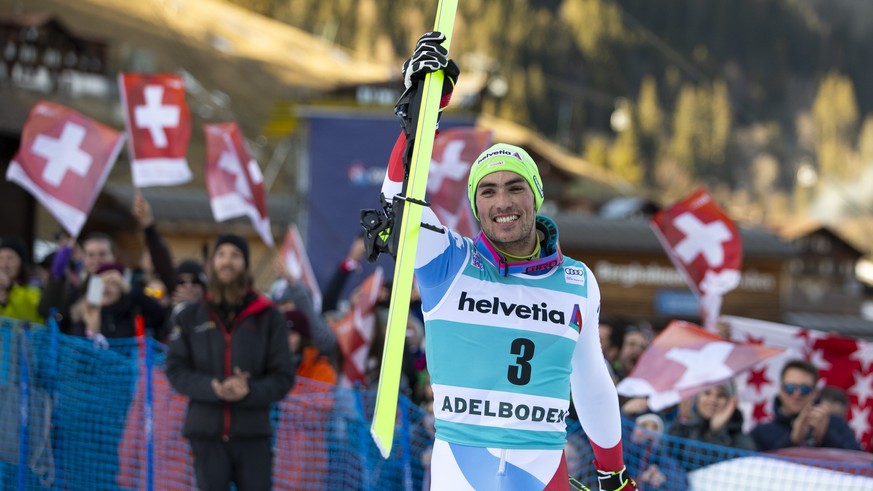 Winner Daniel Yule of Switzerland celebrates on his way to the podium after the men's slalom FIS World Cup race in Adelboden, Switzerland, Sunday, January 12, 2020. (KEYSTONE/Peter Klaunzer)