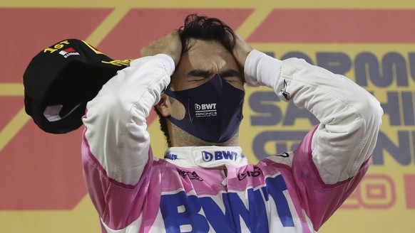 epa08867398 Winner Mexican Formula One driver Sergio Perez of BWT Racing Point celebrates after the 2020 Formula One Sakhir Grand Prix at Bahrain International Circuit near Manama, Bahrain, 06 Decembe ...