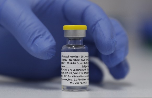 A vial of the Phase 3 Novavax coronavirus vaccine is seen ready for use in the trial at St. George&#039;s University hospital in London Wednesday, Oct. 7, 2020. Novavax Inc. said Thursday Jan. 28, 202 ...