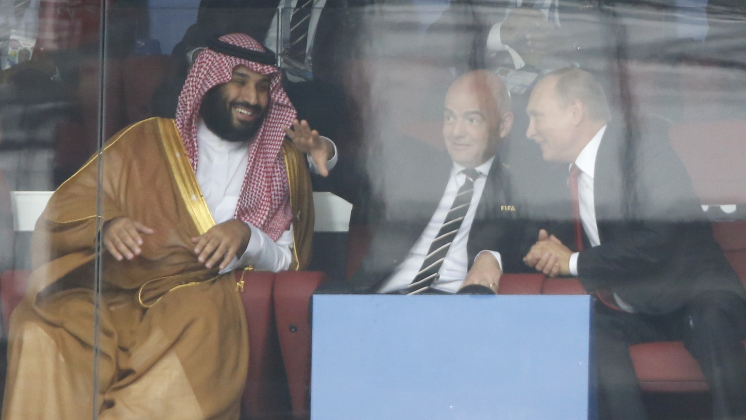 FILE - Saudi Arabia Crown Prince Mohammed bin Salman, left, FIFA President Gianni Infantino, center, and Russian President Vladimir Putin watch the match between Russia and Saudi Arabia which opens th ...