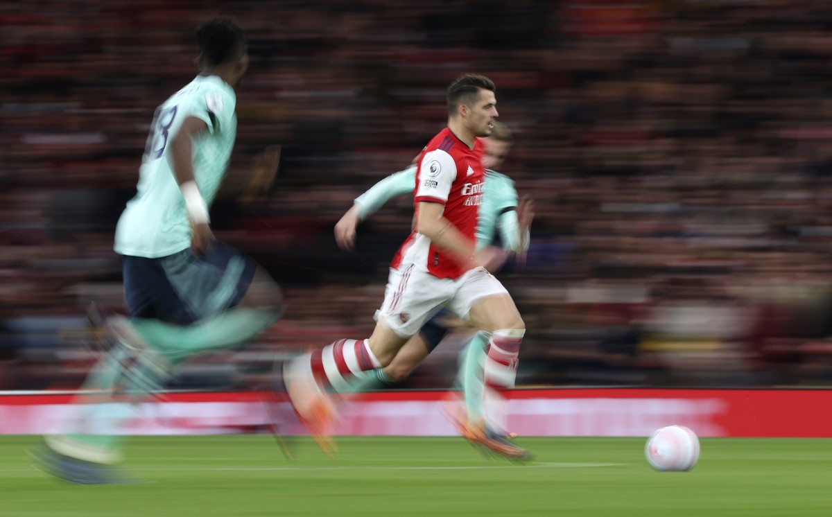 Arsenal's Granit Xhaka controls the ball during the English Premier League soccer match between Arsenal and Leicester City at the Emirates Stadium, in London, Sunday, March 13, 2022. (AP Photo/Ia ...