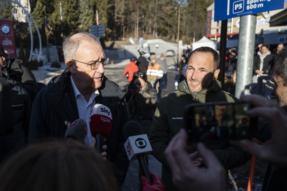 Swiss Federal President Guy Parmelin, left, and Mathias Reynard, State Councillor and president of the Council of State of the Canton of Valais, speak to the media after inspecting the area where a fi ...