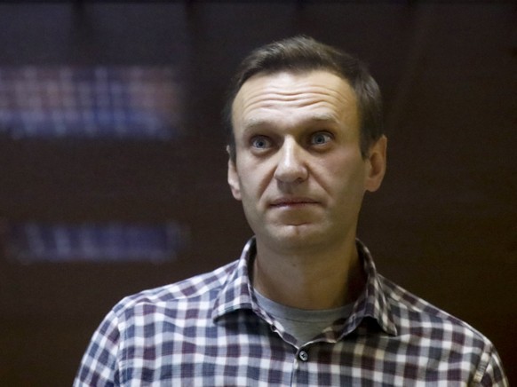 FILE - Russian opposition leader Alexei Navalny stands in a cage in the Babuskinsky District Court in Moscow, Russia on Feb. 20, 2021. The New York-based Train Foundation gave its 2022