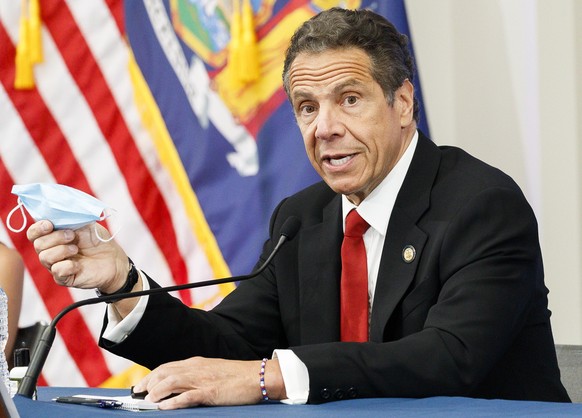 epa08445185 New York Governor Andrew Cuomo holds his daily briefing in a conference room at the New York Stock Exchange in New York, New York, USA, on 26 May 2020. Today is the first day that the stoc ...