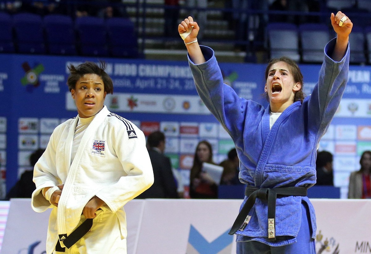 epa05271214 Nora Gjakova of Kosovo (blue) celebrates her victory over Nekoda Smythe Davis of Great Britain during the women's -57 kg category bronze medal bout at the European Judo Championships  ...
