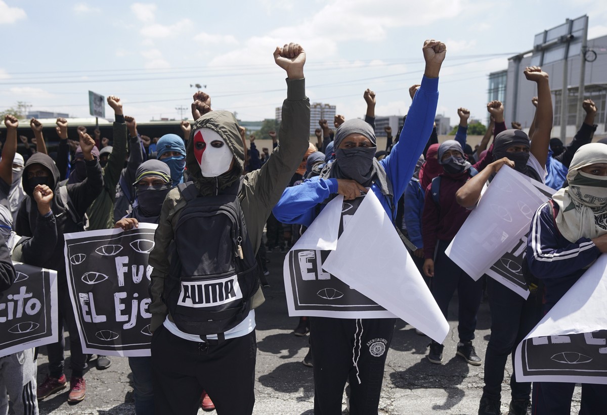 Demonstrators protesting the 2014 disappearance of 43 college students hold signs with a message that reads in Spanish: "It was the Army" in reference to the missing students, during a prote ...