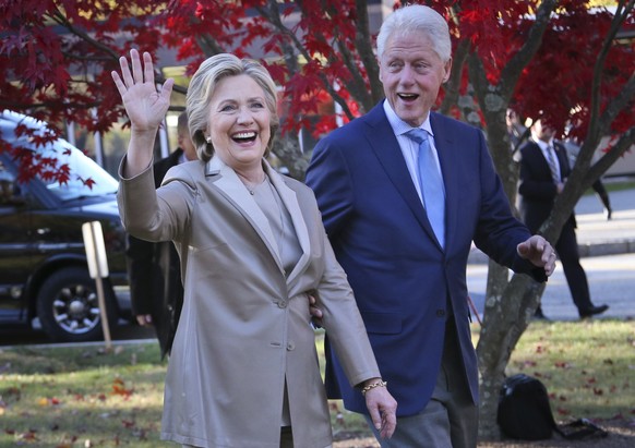 FILE - In this Nov. 8, 2016 file photo, Hillary Clinton and her husband, former President Bill Clinton, greet supporters after voting in Chappaqua, N.Y. Falling in line with tradition, Bill and Hillar ...