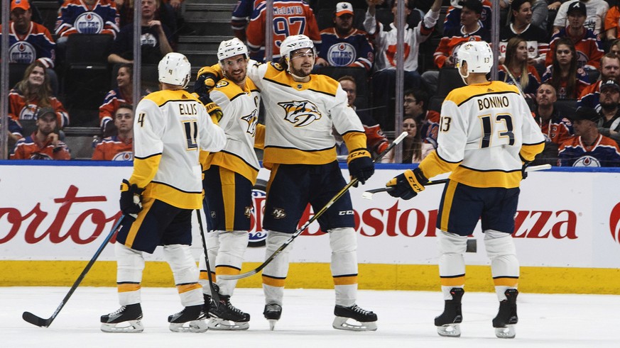 Nashville Predators celebrate an empty net goal during the third period of an NHL hockey game against the Edmonton Oilers in Edmonton, Alberta, Saturday, Oct. 20, 2018. The Predators won, 3-0. (Jason  ...