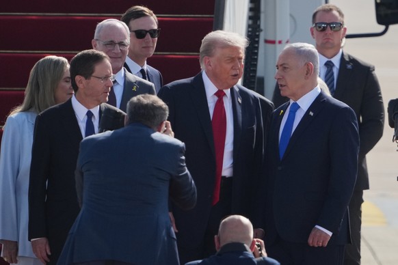 President Donald Trump, center talks with Israel&#039;s Prime Minister Benjamin Netanyahu as he arrives at Ben Gurion Airport near Tel Aviv, Israel, Monday, Oct. 13, 2025. (AP Photo/Ariel Schalit)
Isr ...