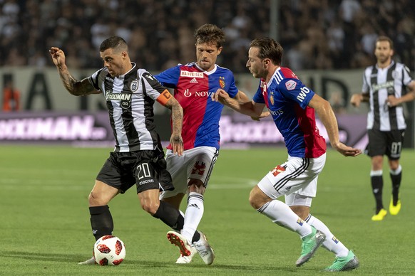 PAOK&#039;s Vieirinha, Basel&#039;s Valentin Stocker and Luca Zuffi, from left, during the UEFA Champions League second qualifying round first leg match between Greece&#039;s PAOK FC and Switzerland&# ...