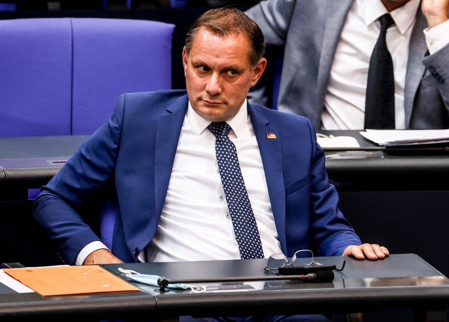 epa09428913 Alternative for Germany party (AfD) co-chairman and top candidate for the upcoming federal elections Tino Chrupalla reacts during a session of the German parliament Bundestag in Berlin, Ge ...