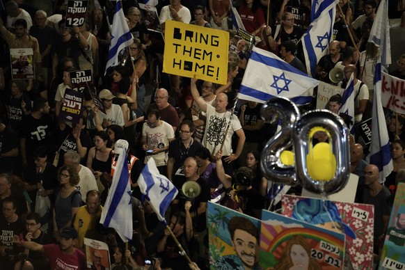 People protest against Israeli Prime Minister Benjamin Netanyahu&#039;s government and call for the release of hostages held in the Gaza Strip by the Hamas militant group, in Tel Aviv, Israel, Saturda ...