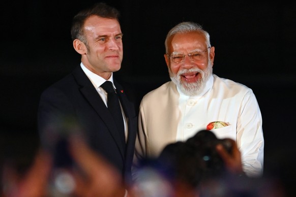 Prime Minister Narendra Modi stands with French President Emmanuel Macron during the launch of the IndiaFrance Year of Innovation and Cultural Commemoration at the Gateway of India in Mumbai, India,  ...