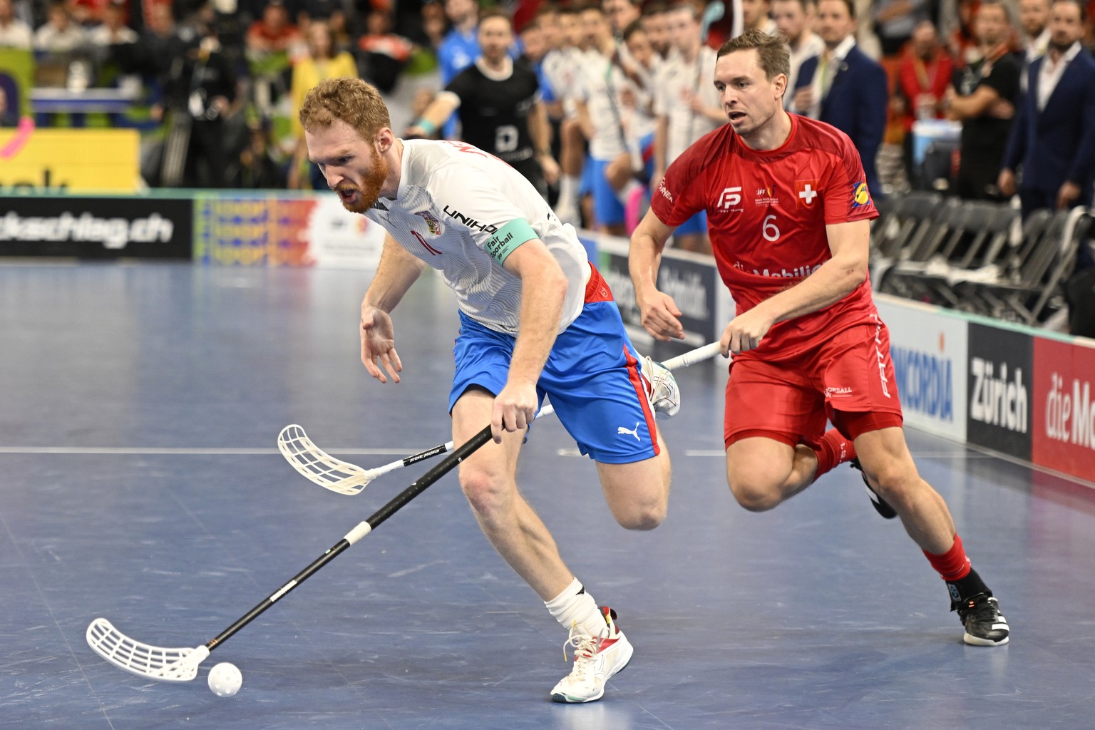 epa10302190 Switzerland&#039;s Claudio Laely, right, and Czech Republics Ondrej Nemecek, left, in action during the 14th Men&#039;s World Floorball Championships Semi Final match between Switzerland a ...