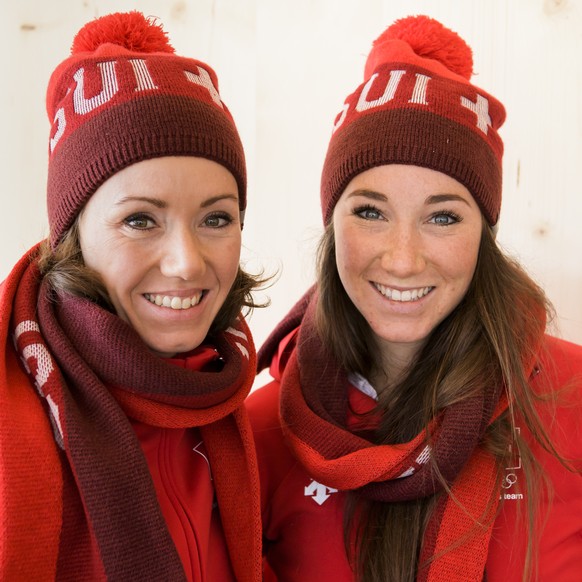 Selina Gasparin, left, and Aita Gasparin, right, biathlete of Switzerland, pose during a media conference of the Swiss Biathlon team in the House of Switzerland one day prior to the opening of the XXI ...