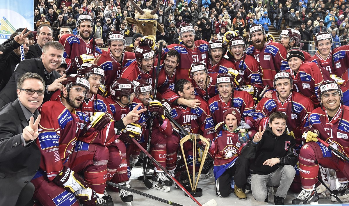 Geneva's player and staff celebrate their victory after the final game between Switzerland's Geneve Servette HC and Russia's HC Salavat Yulaev Ufa at the 88th Spengler Cup ice hockey to ...