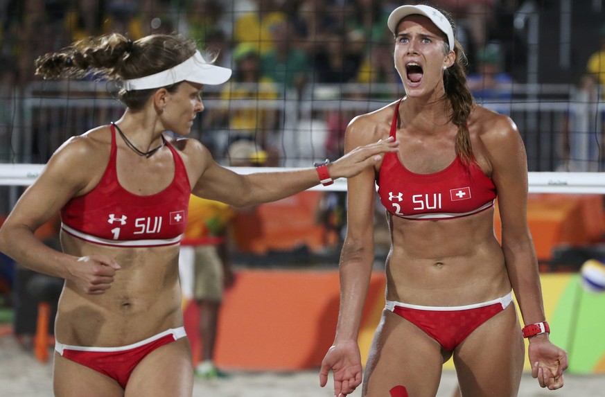 2016 Rio Olympics - Beach Volleyball - Women&#039;s Quarterfinal - Beach Volleyball Arena - Rio de Janeiro, Brazil - 14/08/2016. Nadine Zumkehr (SUI) of Switzerland and Joana Heidrich (SUI) of Switzer ...