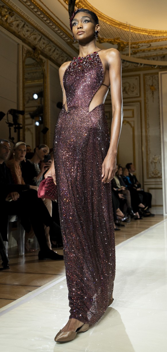 A model wears a creation as part of the Giorgio Armani Prive Haute Couture Spring Summer 2025 collection, that was presented in Paris, Tuesday, Jan. 28, 2025. (AP Photo/Lewis Joly).
