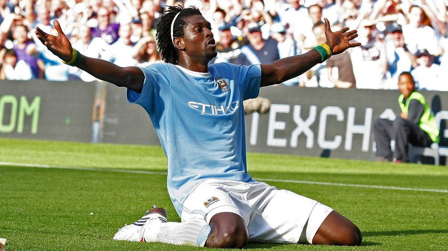 Mandatory Credit: Photo by Ian Hodgson/ANL/Shutterstock 3361583a Manchester City V Arsenal - Man City Emmanuel Adebayor Celebrates In Front Of Arsenal Fans. Manchester City V Arsenal - Man City Emmanu ...