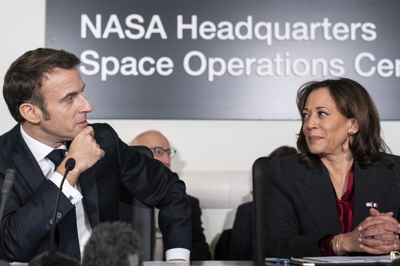 French President Emmanuel Macron, left, and Vice President Kamala Harris speak during a meeting to highlight space cooperation between the two countries, at NASA headquarters in Washington, Wednesday, ...