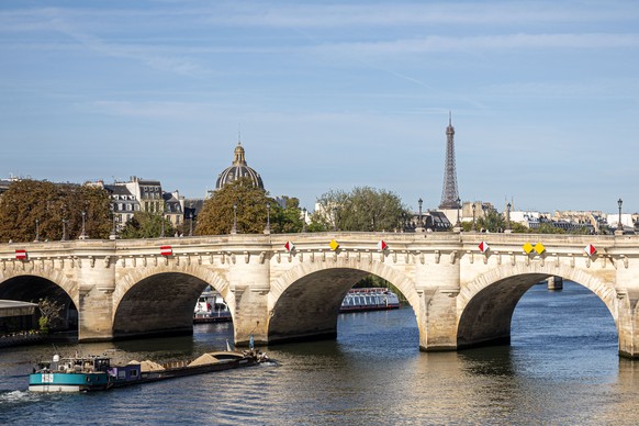 epa12356539 General view of Pont-Neuf (New Bridge) and the Eiffel Tower on the first day of an exhibition marking the 40th anniversary of artists Christo and Jeanne-Claude's transformation of the ...