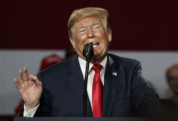 President Donald Trump gestures as he speaks at a rally at Olentangy Orange High School in Lewis Center, Ohio, Saturday, Aug. 4, 2018. (AP Photo/Carolyn Kaster)