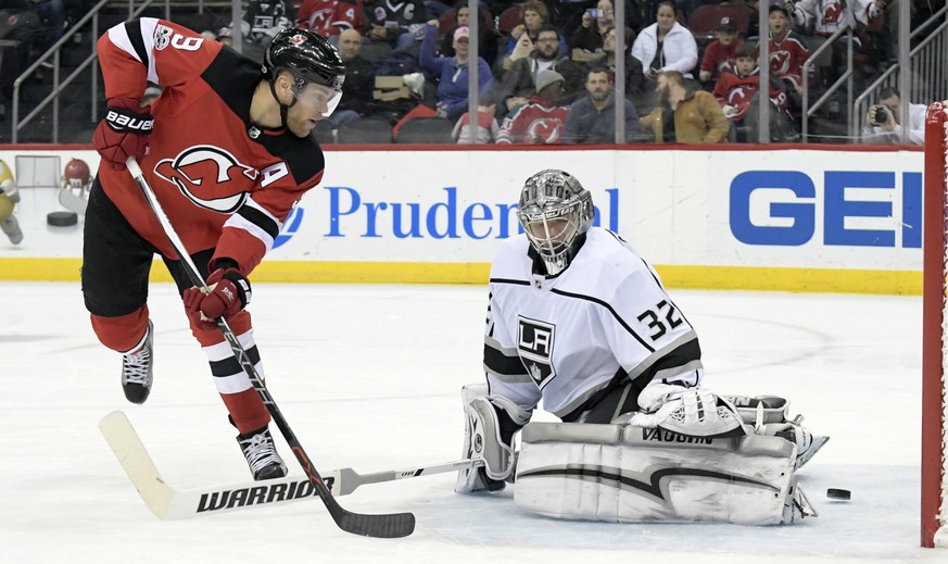 New Jersey Devils left wing Taylor Hall (9) scores a goal past Los Angeles Kings goalie Jonathan Quick (32) during the second period of an NHL hockey game Tuesday, Dec.12, 2017, in Newark, N.J. (AP Ph ...