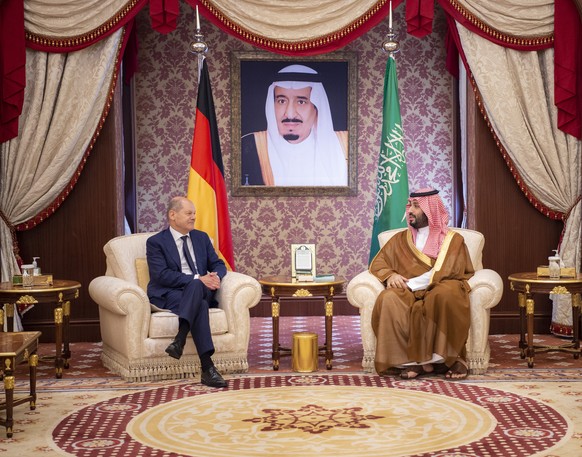 epa10203460 A handout photo made available by the Saudi Royal Court shows Saudi Crown Prince Mohammed bin Salman al-Saud (R) meeting with German Chancellor Olaf Scholz (L) in Jeddah, Saudi Arabia, 24  ...