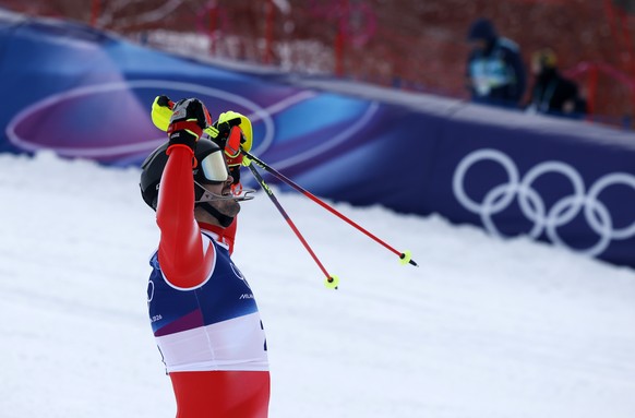 epa12746669 Loic Meillard of Switzerland celebrates in the finish area during the 2nd run of the Men's Slalom of the Alpine Skiing competitions at the Milano Cortina 2026 Winter Olympic Games, St ...