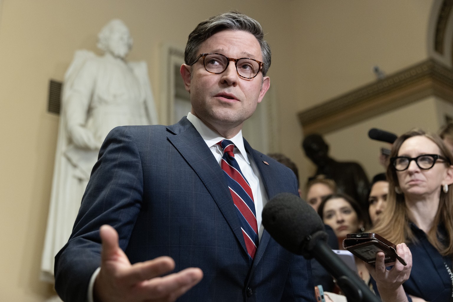 epa11024857 US Speaker of the House Mike Johnson delivers remarks after attending a meeting with Ukrainian president on Capitol Hill in Washington, DC, USA, 12 December 2023. Ukrainian President Zelen ...