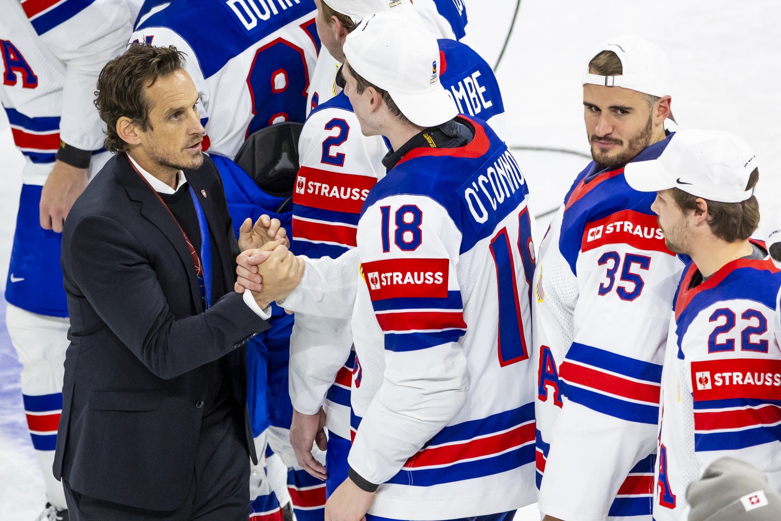 epa12135717 Patrick Fischer, head coach of Switzerland national ice hockey team reacts after the victory of the team USA in the IIHF Ice Hockey World Championship final match between Switzerland and t ...