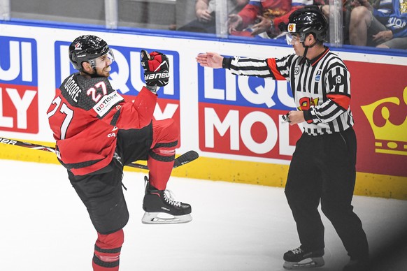 epa07603705 Shea Theodore (L) of Canada celebrates after scoring the 1-0 lead during the IIHF World Championship ice hockey final between Canada and Finland at the Ondrej Nepela Arena in Bratislava, S ...