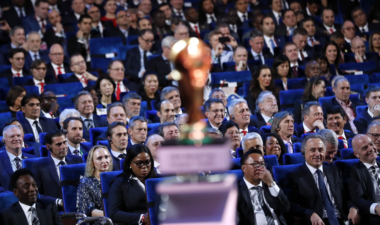 Brazilian soccer legend Pele, bottom second left, FIFA president Gianni Infantino, bottom right, and Vitaly Mutko, Russian Federation Deputy Prime Minister &amp; Local Organising Committee Chairman, b ...