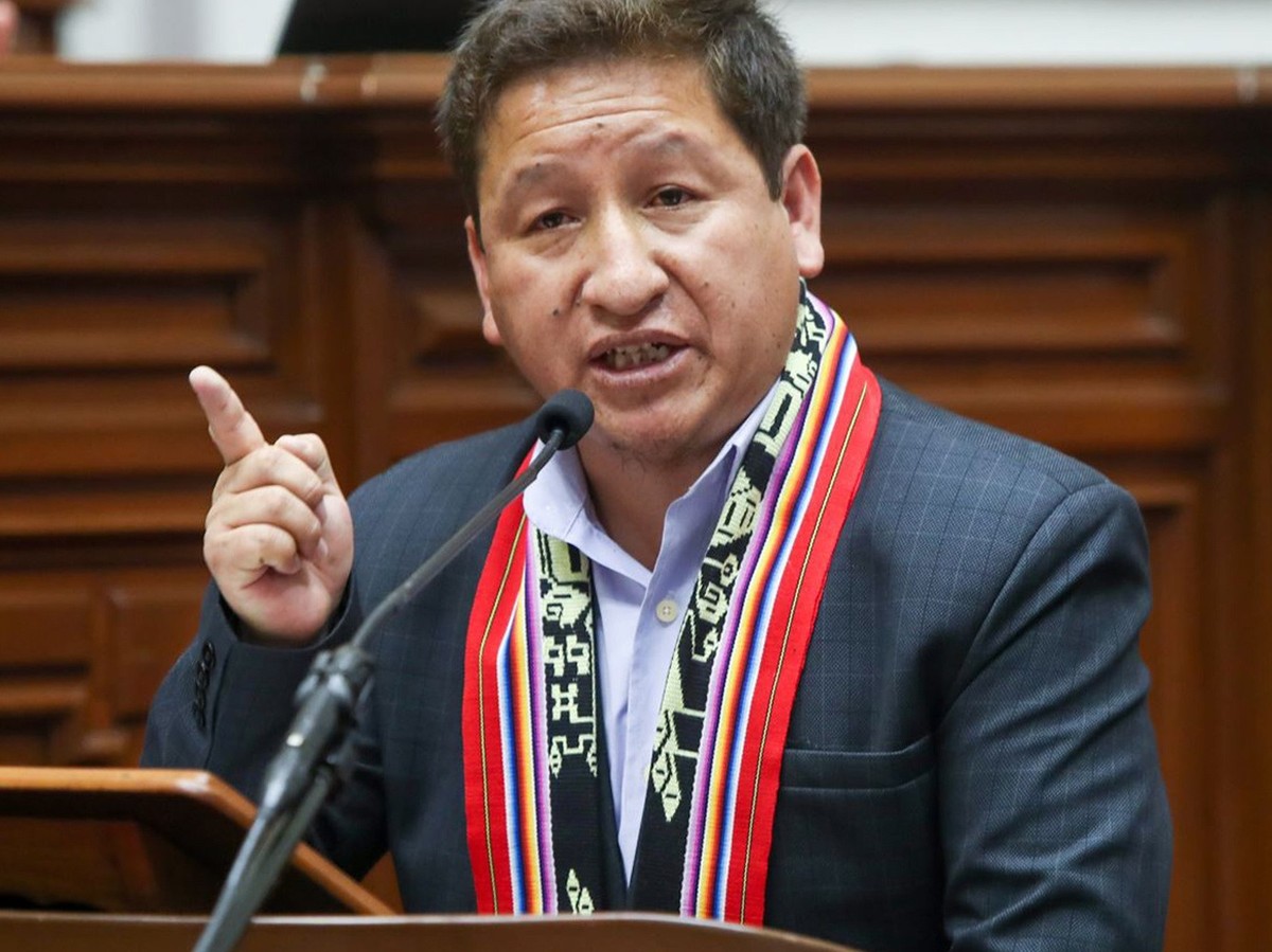 epa09432900 A handout photo made available by the Andean Agency shows the Peruvian Prime Minister, Guido Bellido, while addressing Congress, in Lima, Peru, 27 August 2021. The cabinet of ministers of  ...