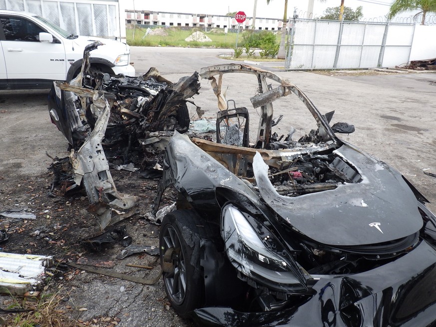 This image provided by the National Transportation Safety Board shows damage to a 2021 Tesla Model 3 Long Range Dual Motor electric car following a crash in September, 2021, in Coral Gables, Fla. The  ...