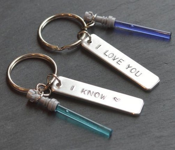 His and Hers Star Wars Key rings 
https://hips.hearstapps.com/pop.h-cdn.co/assets/17/18/1493750577-1493351721-star-wars-key-ring.jpg?crop=1xw:1.0xh;center,top&amp;resize=768:*&amp;keepGifs=1