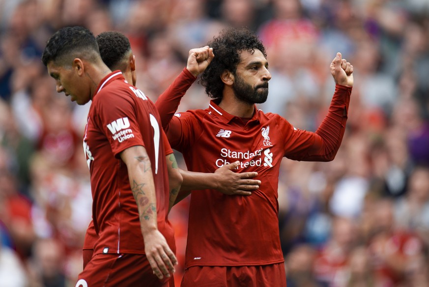 epa06945711 Liverpool&#039;s Mohamed Salah celebrates scoring the opening goal during the English Premier League soccer match between Liverpool and West Ham at the Anfield in Liverpool, Britain, 12 Au ...