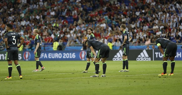 Football Soccer - Portugal v Wales - EURO 2016 - Semi Final - Stade de Lyon, Lyon, France - 6/7/16
Wales&#039; Neil Taylor, Ashley Williams and James Chester 
REUTERS/Carl Recine
Livepic