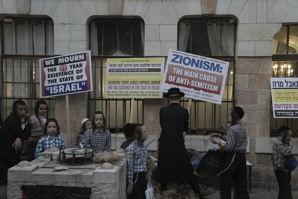 Ultra-Orthodox Jews who oppose Zionism and the Israeli state hold a procession as they protest against Israel&#039;s 77th Independence Day, in the Mea Shearim neighborhood of Jerusalem, Thursday, May  ...