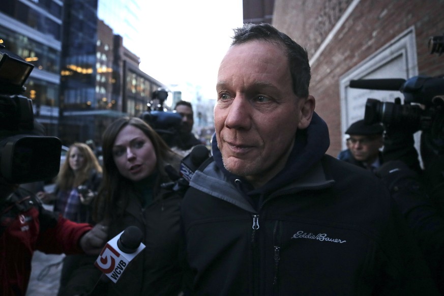 Harvard University professor Charles Lieber is surrounded by reporters as he leaves the Moakley Federal Courthouse in Boston, Thursday, Jan. 30, 2020. Leiber, chair of the department of chemistry and  ...