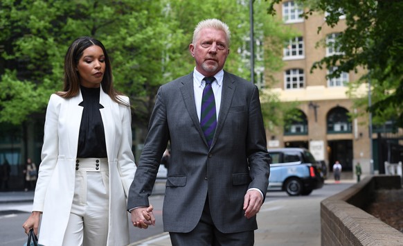 epaselect epa09916246 Former tennis champion Boris Becker (R) arrives at Southwark Crown Court with his partner Lilian de Carvalho in London, Britain, 29 April 2022. Becker is due to be sentenced in h ...